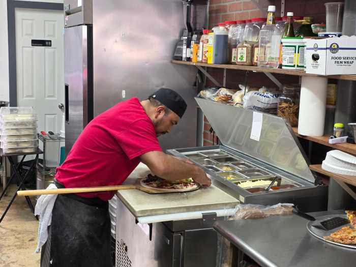 German of Five Dreams Pizzeria prepares a mole pizza. Photo: Shane O'Brien.