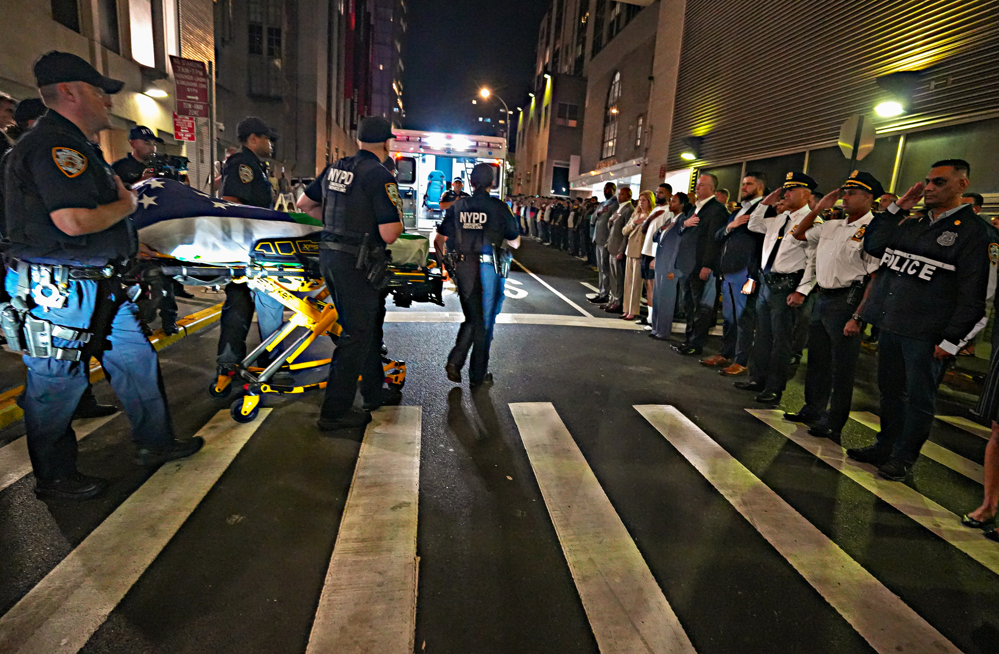 The body of the NYPD officer killed during Monday’s mass shooting in Midtown was transferred from the hospital to the Chief Medical Examiner overnight in a dignified transfer.