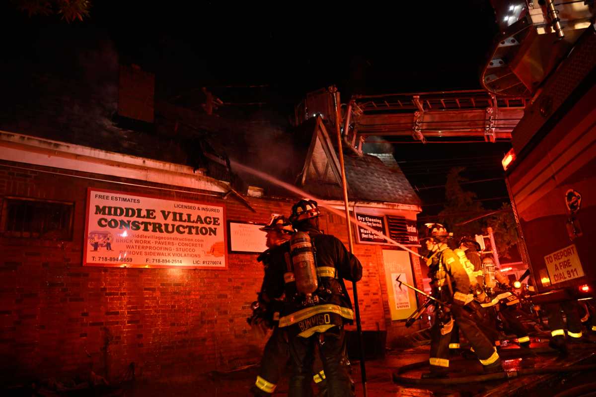 The FDNY battled a ferocious four alarm fire that ripped through seven one-story commercial buildings on Dry Harbor Road in Middle Village on July 28.