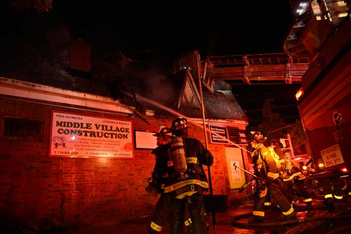 The FDNY battled a ferocious four alarm fire that ripped through seven one-story commercial buildings on Dry Harbor Road in Middle Village on July 28.