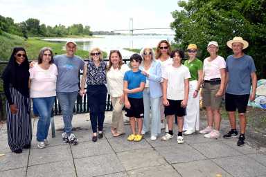 New York City Council Member Vickie Paladino (seventh from left) and NYC Parks Commissioner Iris Rodriguez-Rosa (fifth from left) celebrated the completion of the repainting of the basketball courts at Francis Lewis Park and the restoration of trails at Powell's Cove Park.