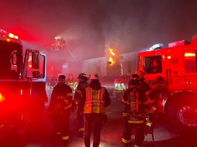 Five civilians and two firefighters were injured after fire broke out in a three-story building in Murray Hill early Monday morning.
