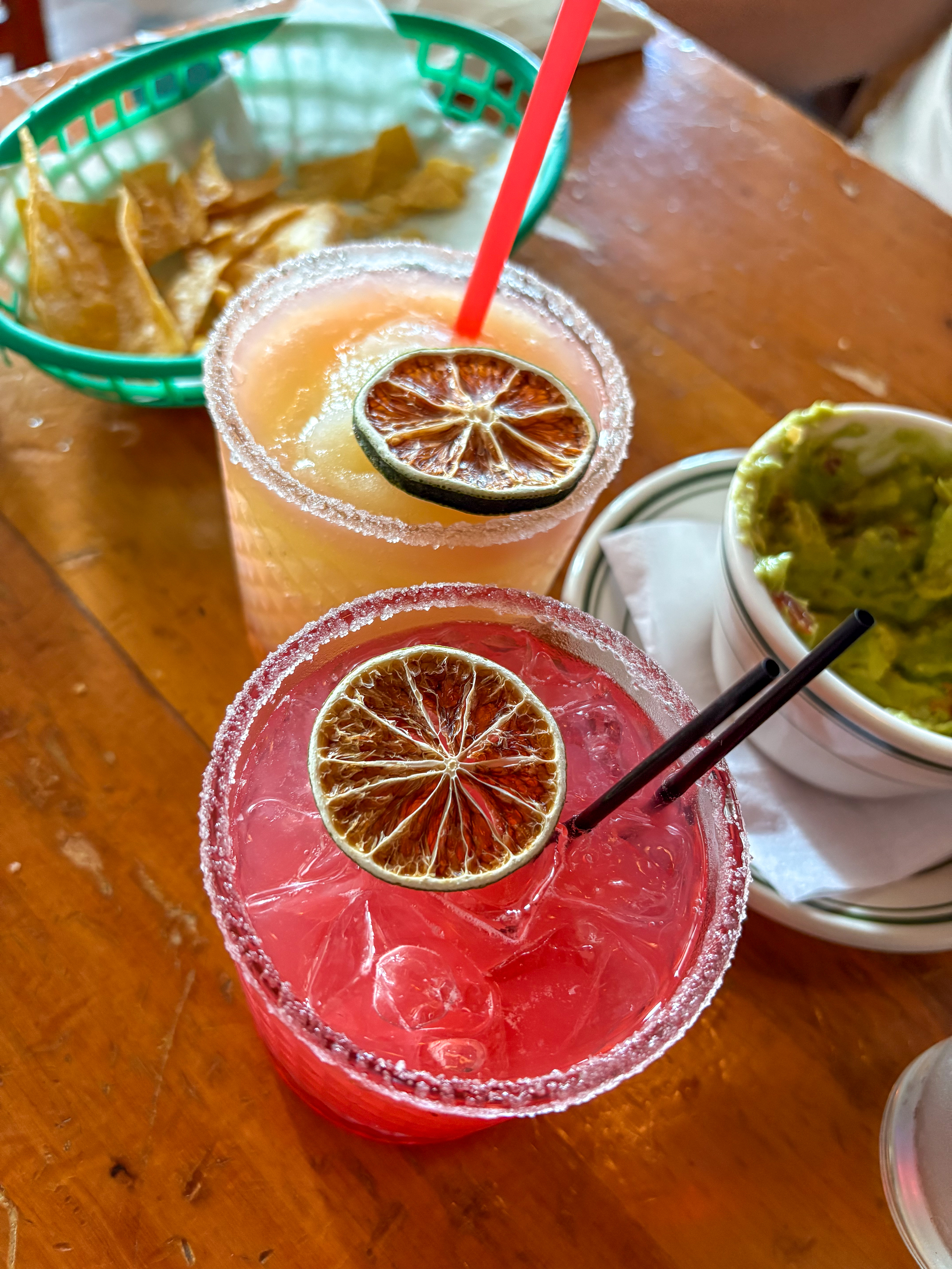 A pair of flavored margaritas, a mango frozen margarita and a strawberry margarita on the rocks, at Skinny's Cantina in Long Island City.