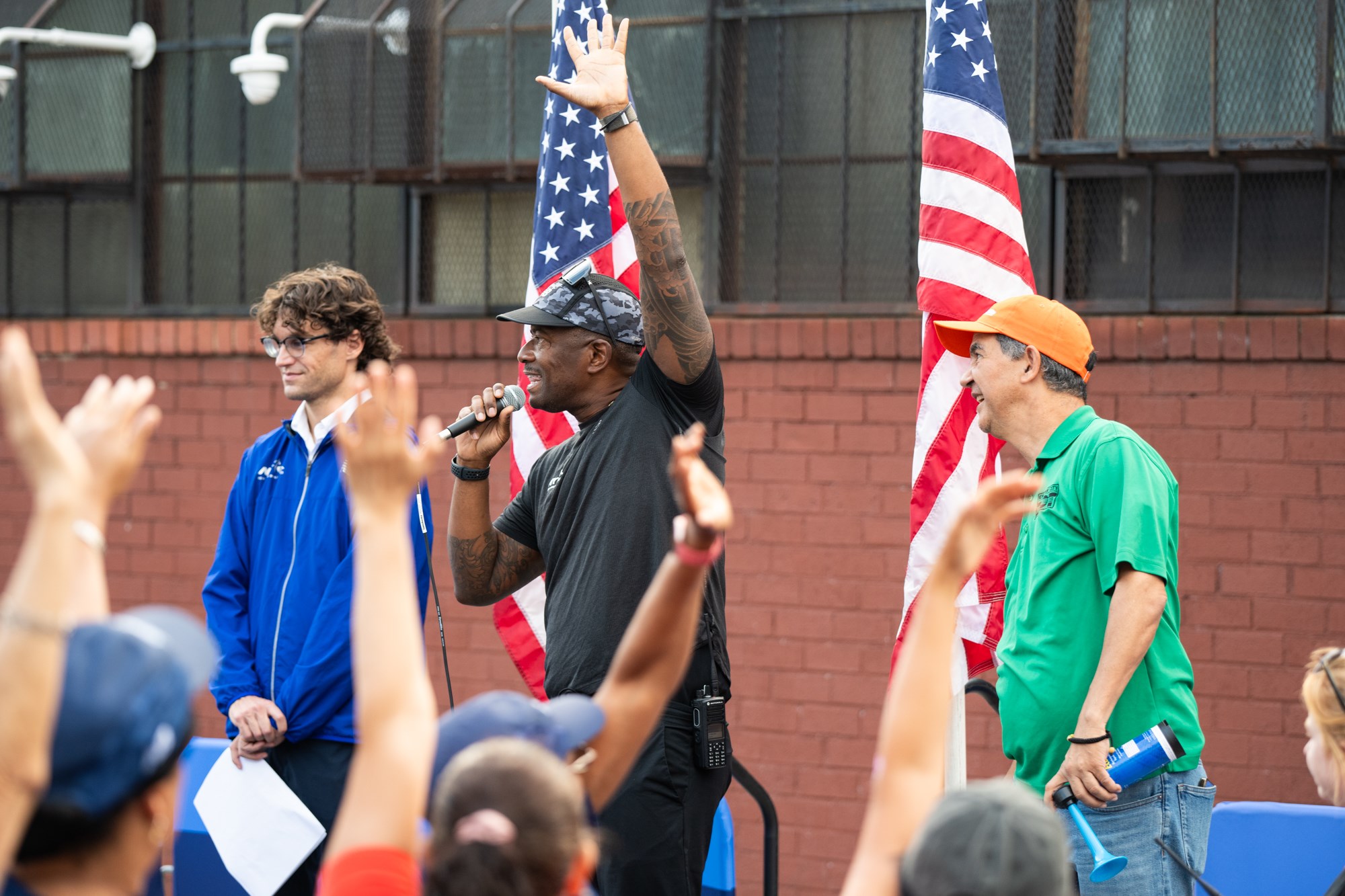 Ted Metellus, the NYRR Chief Event Production Officer, addressed the crowd at the start line of the inaugural NYRR Start Line Series run in Long Island City.