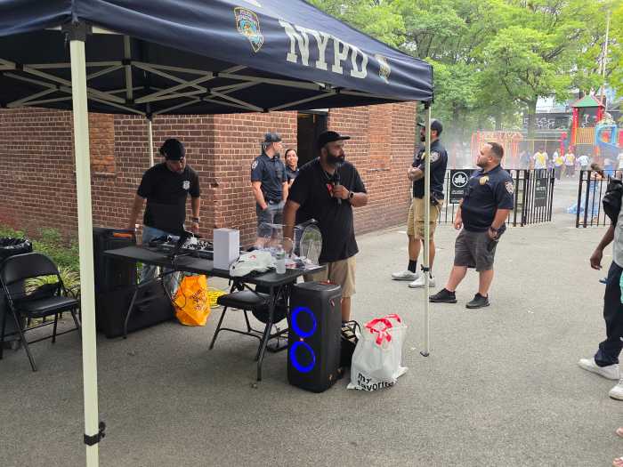 The 108th Precinct held a raffle during National Night Out celebrations at Lou Lodati Park on Tuesday. Photo: Shane O'Brien.