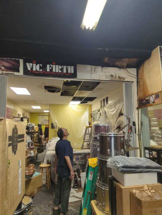 Tony Fabiano surveys the damage to his store. Photo courtesy of Anastasia Timoshenko. 