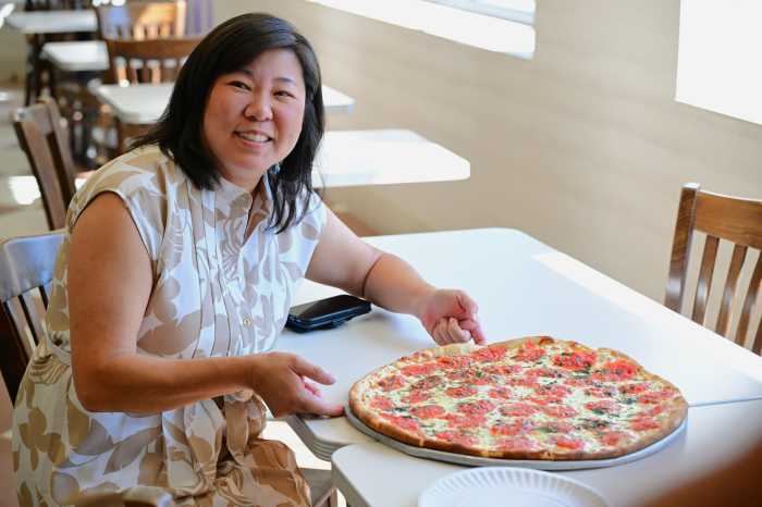 U.S. Rep. Grace Meng celebrates the grand reopening of Rosa's Pizza. Photo: Ramy Mahmoud. 