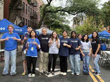 Projekt NYC representatives at Wednesday's free backpack giveaway. Photo courtesy of Projekt NYC.
