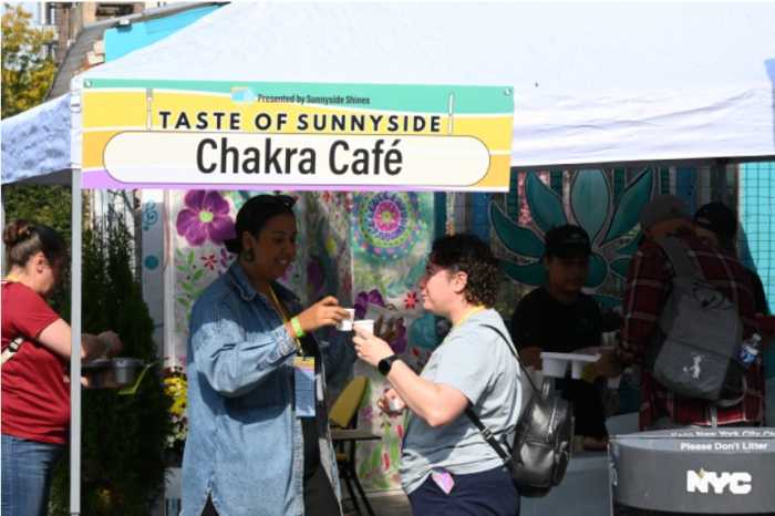 Attendees sample food at Chakra Cafe during the 2024 Taste of Sunnyside. Photo: Ramy Mahmoud.