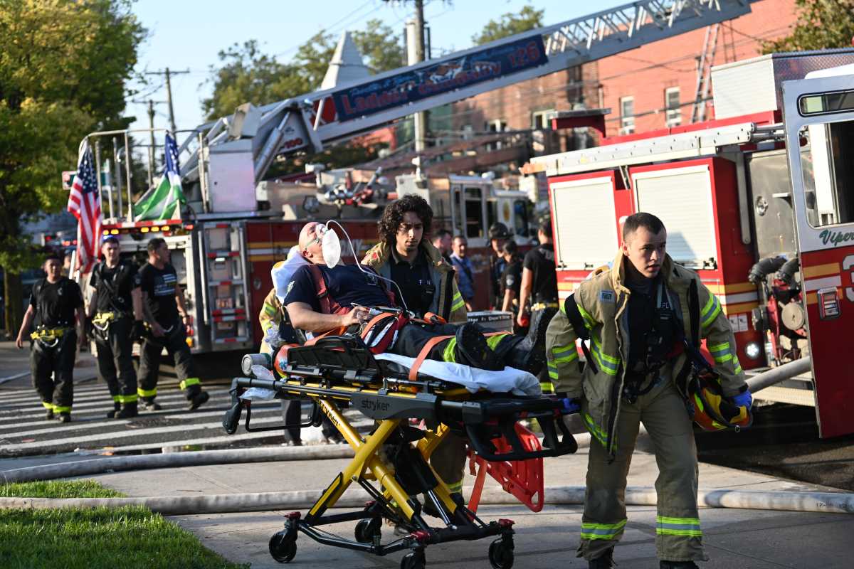 Three firefighters were injured while battled a raging four alarm fire in a row of two-story mixed use buildings on Aug. 10 at 114-42 through 114-48 Stuphin Blvd. in South Jamaica.