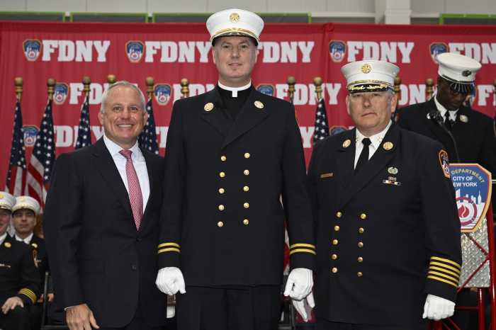 Chaplain Peter Purpura is flanked by FDNY Commissioner Robert Tucker and Chief of Department John Esposito..