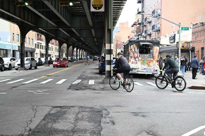 Cyclists along 31st Street in Astoria.