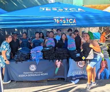 Assembly Member Jessica González-Rojas poses with staff members and volunteers at the Corona backpack giveaway. Photo courtesy of Assembly Member Jessica González-Rojas.