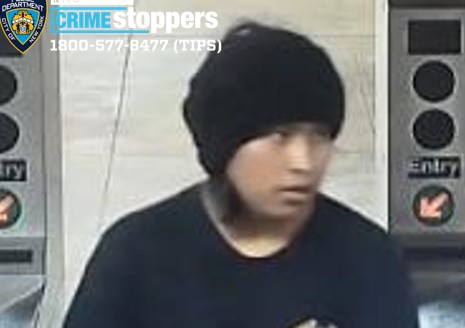 Cops are looking for this suspect, who allegedly robbed a woman at knifepoint on Justice Avenue in Elmhurst.