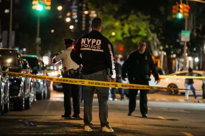 A suspect is wanted for allegedly shooting a woman on Beach 17th Street near the Rockaway Boardwalk on Sunday, Aug. 10.