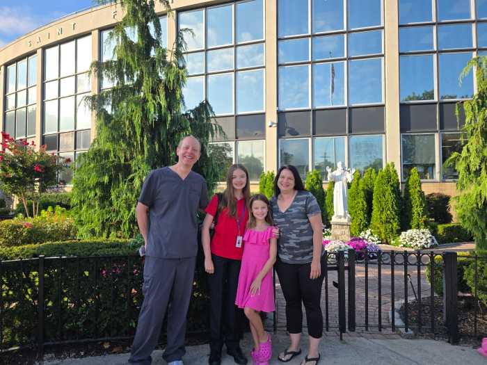Todd, Mia, Sophia and Christina Hartmann ahead of Mia's first day at St. Francis Prep. Photo: Shane O'Brien.
