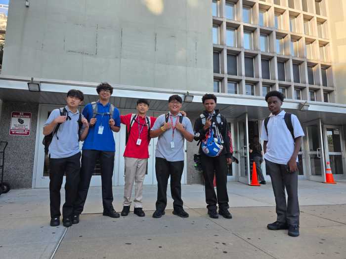 Max Carabbo (center, gray shirt) with his friends outside St. Francis Prep. Photo: Shane O'Brien