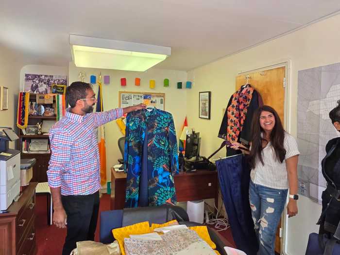 Krishnan surveys a peacock-themed sherwani. Photo: Shane O'Brien