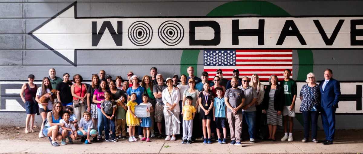 Community members gathered to paint “Kids Make Neighborhoods," with the Woodhaven Mural Project this past Memorial Day.