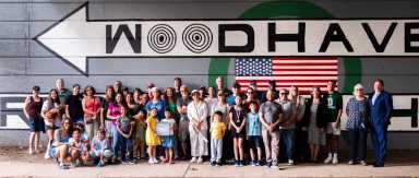 Community members gathered to paint “Kids Make Neighborhoods," with the Woodhaven Mural Project this past Memorial Day.
