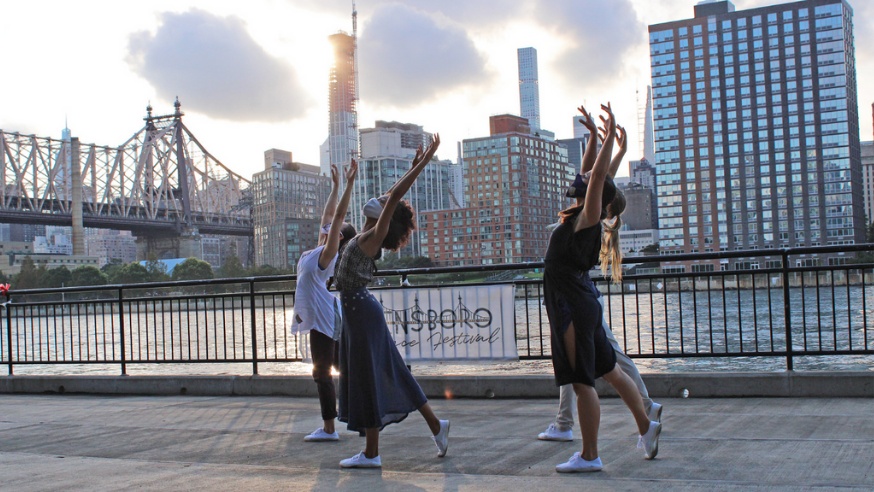 Members of the Queensboro Dance Festival performing near the Queensboro Bridge (Dancing with the Queens Stars)
