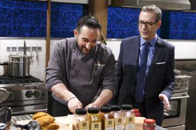 Host-Ted-Allen-checks-in-on-chef-Nicholas-Poulmentis-as-he-cooks