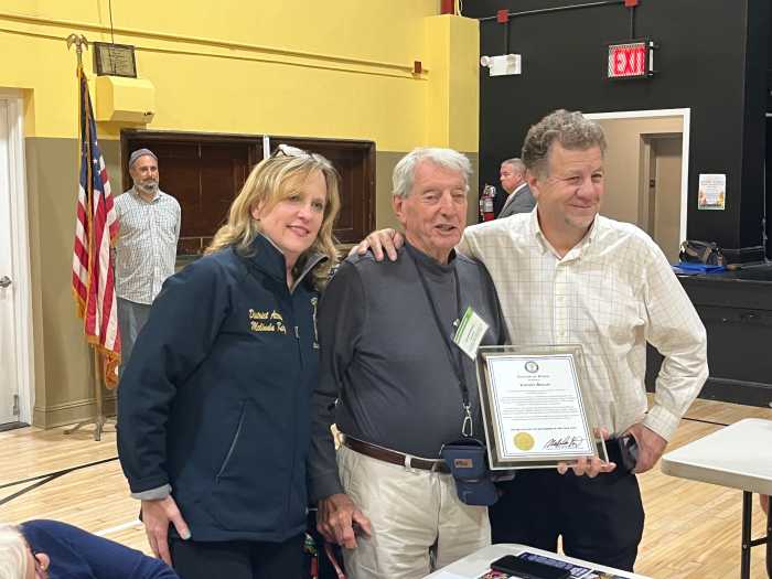 Queens DA Melinda Katz (l.) honored Vincent Arcuri (c.) for his decades-long service to Community Board 5 and the greater Glendale community.