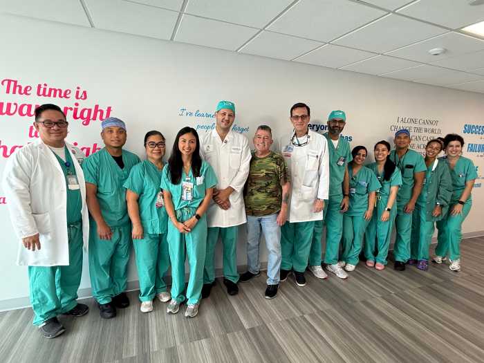 Frank Parlatore poses for photographs with Mount Sinai medical staff after recovering from a major cardiac arrest. Photo Cathy Clarke/Mount Sinai Hospital