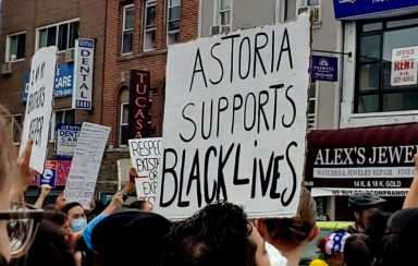 Protester-sign-in-Astoria-Tuesday-@JLa_NYC-via-Twitter