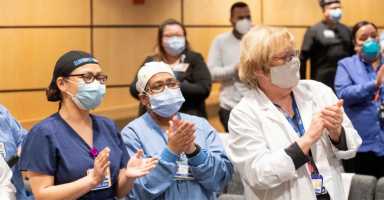 Staff-at-NYC-Health-Hospitals_Elmhurst-celebrate-complimentary-vacations-from-American-Airlines-and-Hyatt-Photo-by-AA