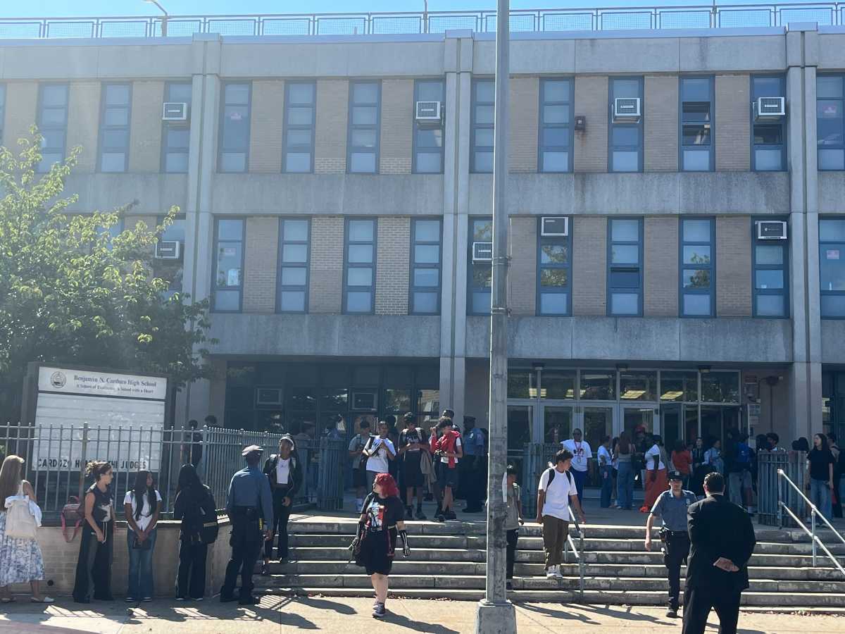 As students at Cardozo High were getting used to increased security on their Bayside campus, their 16-year-old classmate was being criminally charged for bringing a loaded gun to school and making terroristic threats.
