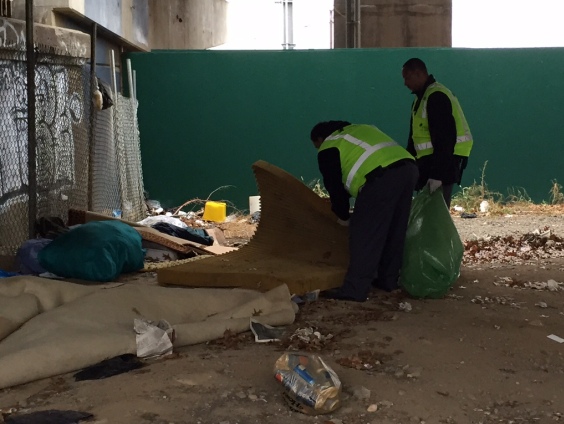 Workers cleaning up the trash