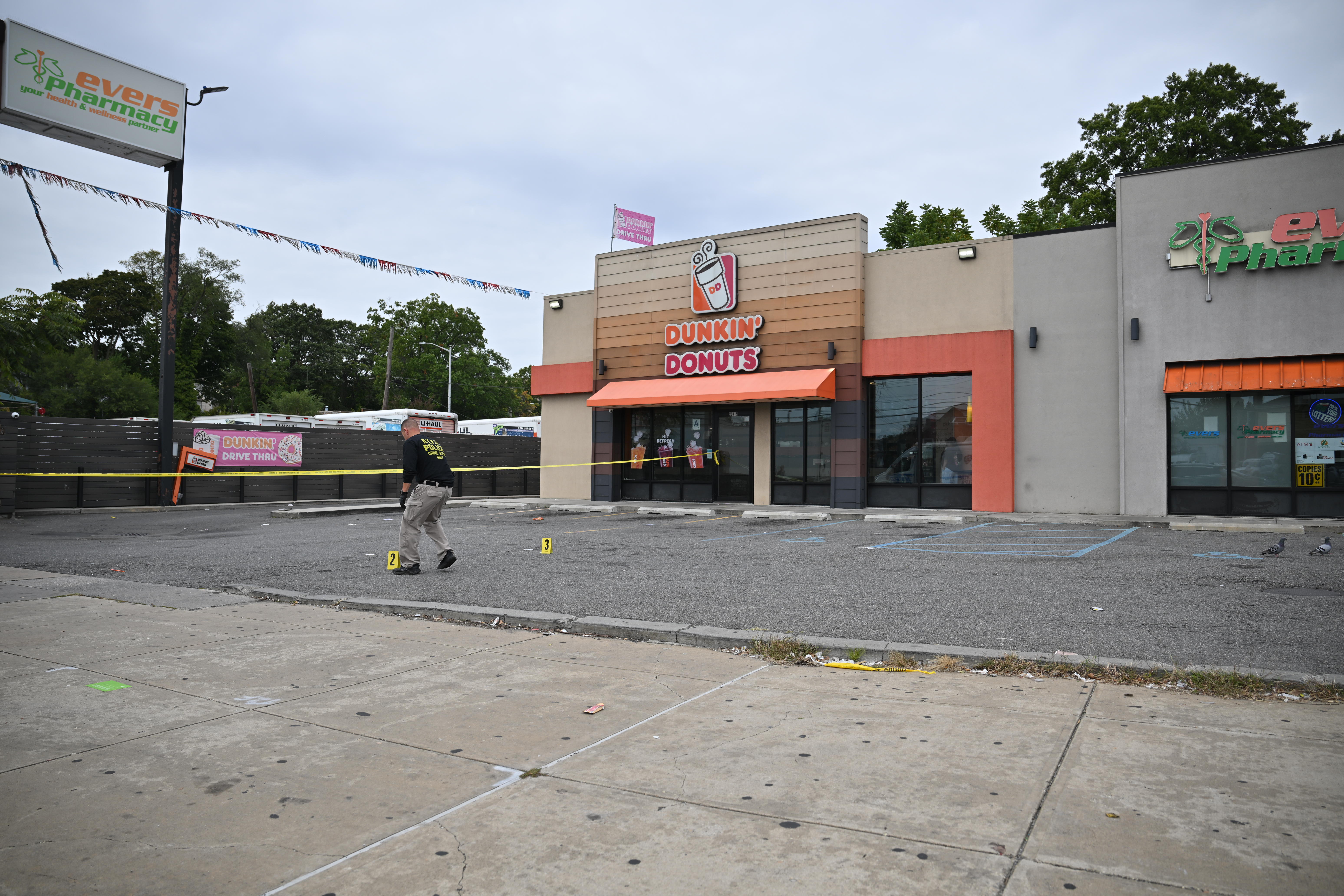 Police at the scene of the shooting at the Dunkin’ Donuts at 208-15 Linden Blvd. in Cambria Heights.