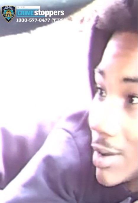 The teenager surrendered, accompanied by his attorney, a day after the NYPD circulated surveillance images of him running from the scene of the crime holding a firearm.