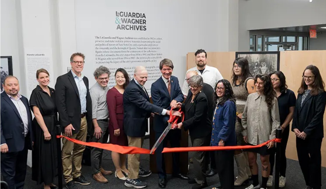 From left to right: Oleg Kleban; Dr. Molly Rosner; Dr. Stephen Petrus; Council Member Lincoln Restler; Council Member Julie Won; Dr. Richard Lieberman; President Kenneth Adams; Jennifer Jensen; Andrew Tripp; Assembly Member Claire Valdez; Riley Owens; Molly Jacobson; Nathaly Pozo; and Gretchen Aguiar at a ribbon-cutting for the renovated LaGuardia and Wagner archives. Photo courtesy of LaGuardia Community College.
