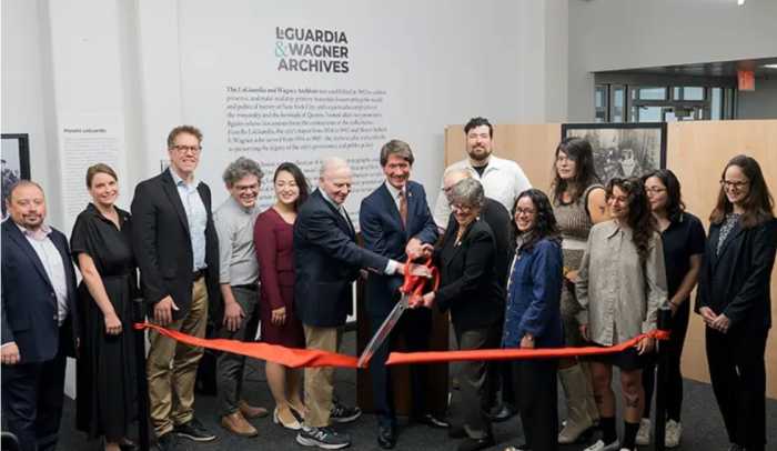 From left to right: Oleg Kleban; Dr. Molly Rosner; Dr. Stephen Petrus; Council Member Lincoln Restler; Council Member Julie Won; Dr. Richard Lieberman; President Kenneth Adams; Jennifer Jensen; Andrew Tripp; Assembly Member Claire Valdez; Riley Owens; Molly Jacobson; Nathaly Pozo; and Gretchen Aguiar at a ribbon-cutting for the renovated LaGuardia and Wagner archives. Photo courtesy of LaGuardia Community College.