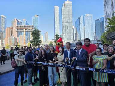 DOT representatives, elected officials and community leaders cut the ribbon at the new 29th Street Plaza on Monday. Photo: Shane O'Brien.