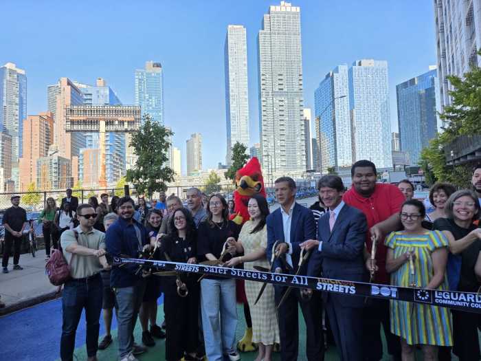 DOT representatives, elected officials and community leaders cut the ribbon at the new 29th Street Plaza on Monday. Photo: Shane O'Brien.