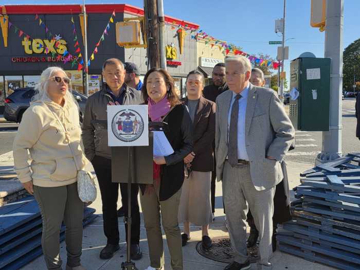 Council Member Linda Lee speaks at an event denouncing gun violence following the shooting of a 16-year-old school student at the intersection of Union Turnpike and Springfield Boulevard on Tuesday. Photo: Shane O'Brien.