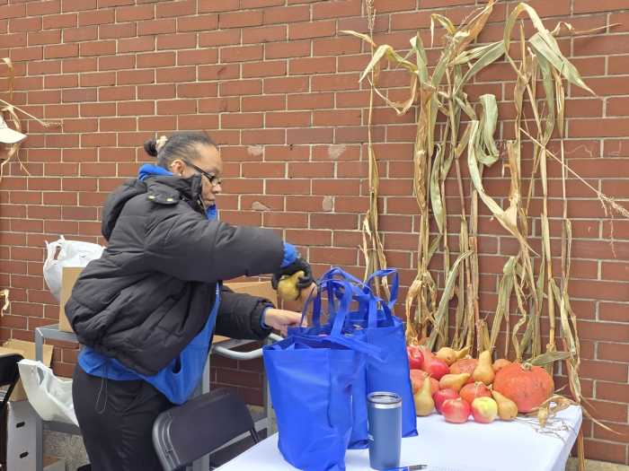 Fortune Society staff pack grocery bags outside the non-profit's LIC location. Photo by Shane O'Brien.