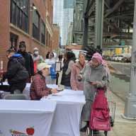 Individuals sign up to the Fortune Society's new weekly food distribution program in Long Island City. Photo by Shane O'Brien.