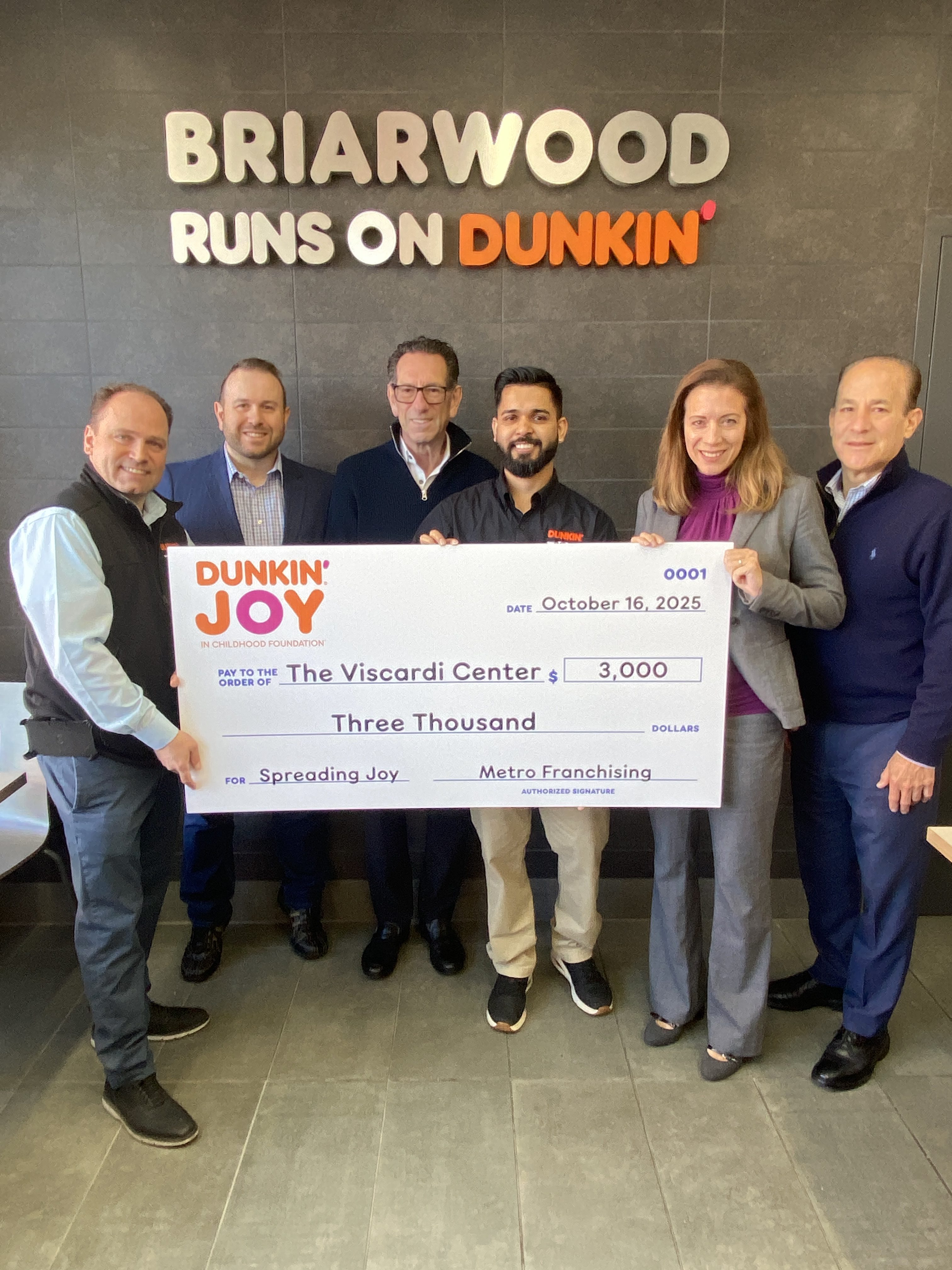 Representatives from Metro Franchising presented the Viscardi Center with a $3,000 donation, in collaboration with the Dunkin’ Joy in Childhood Foundation, in celebration of the Briarwood Dunkin’ grand reopening.