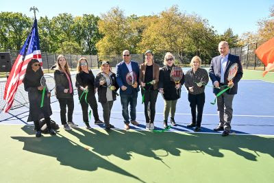 USTA officials, Parks representatives and Assembly Member Nily Rozic cut the ribbon at newly refurbished tennis courts at Kissena Park on Oct. 17.