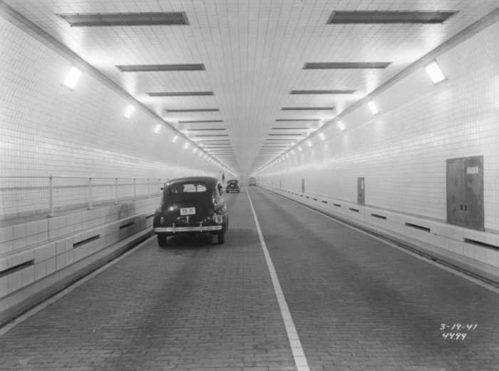 Traffic travels west in the Queens Midtown Tunnel, shortly after its opening. March 19, 1941. Photograph by Somach Photo Service.