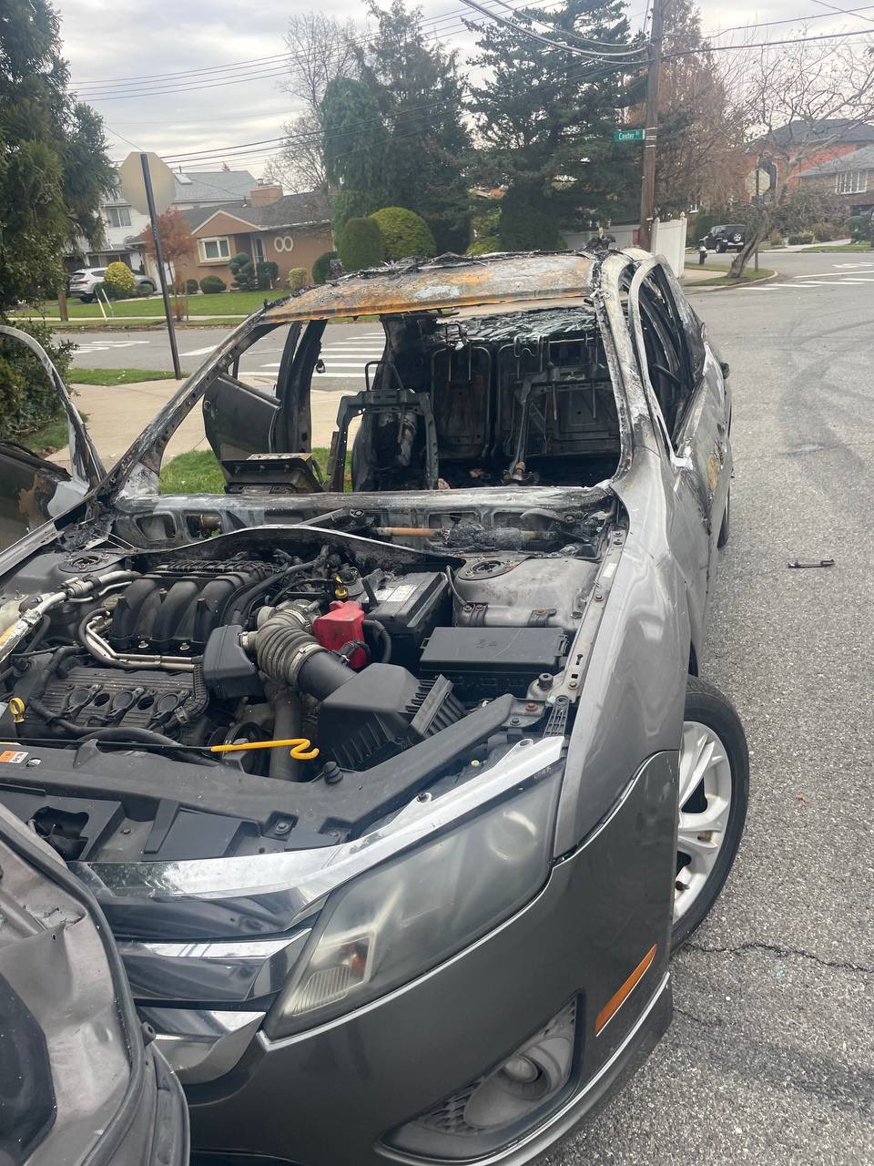 A Malba homeowner's company car was destroyed when the mob set it alight with fireworks.