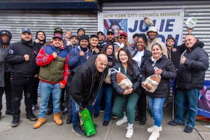 Council Member at a turkey distribution event at Queensbridge Houses. Photo via Emil Cohen/NYC Council Media Unit