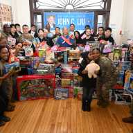 State Sen. John Liu and Champions Martial Arts donated hundreds of toys to families of soldiers at Fort Totten. Photo by Ramy Mahmoud.