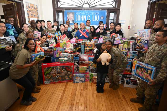 State Sen. John Liu and Champions Martial Arts donated hundreds of toys to families of soldiers at Fort Totten. Photo by Ramy Mahmoud.