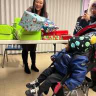 Won distributes toys at an event at Ravenswood Houses on Friday. Photo courtesy of office of Council Member Julie Won.