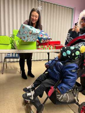 Won distributes toys at an event at Ravenswood Houses on Friday. Photo courtesy of office of Council Member Julie Won.